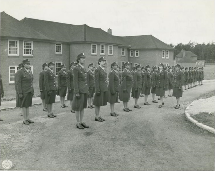 Army nurses standing at attention in front of their barrack