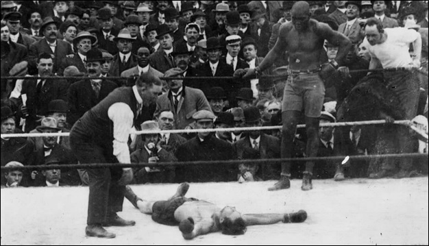 Jack Johnson knocks out Stanley Ketchel in the 12th round after being knocked down by Kerchel earlier in the round.