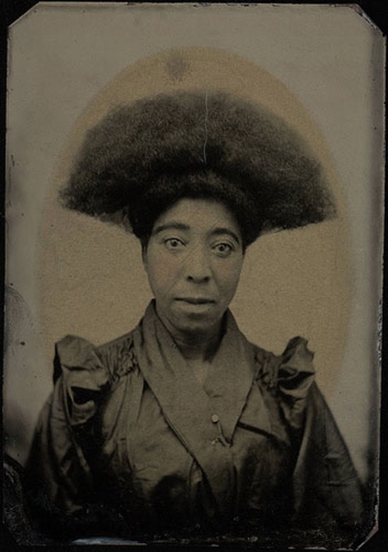 Bust portrait, woman with "Afro" hair dressing