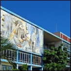 Main building with mural — at the Universidad de Oriente,